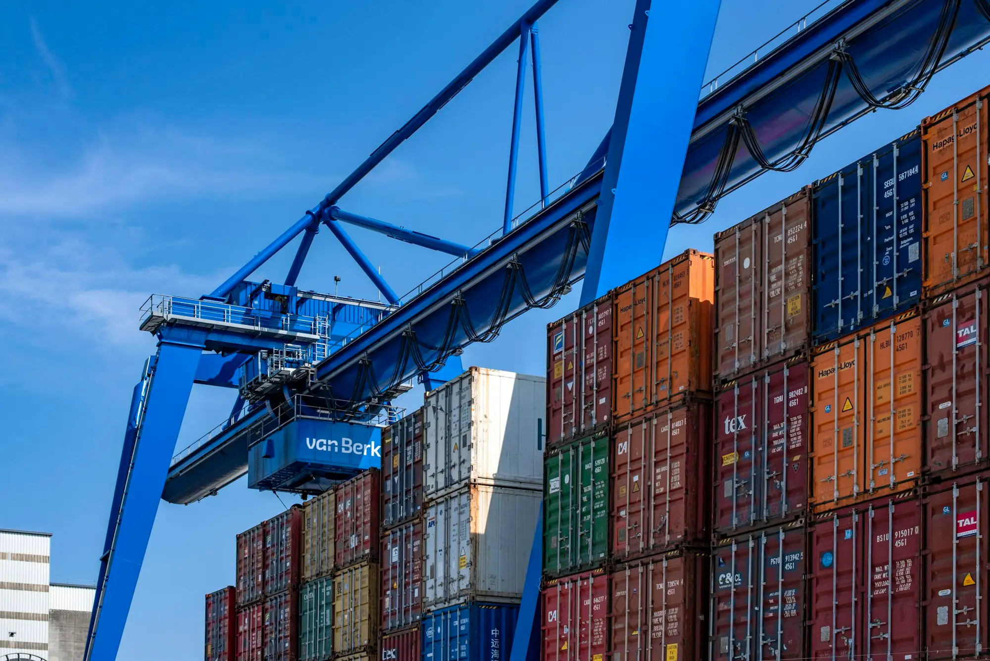 Gantry cranes and stacked shipping containers at a port