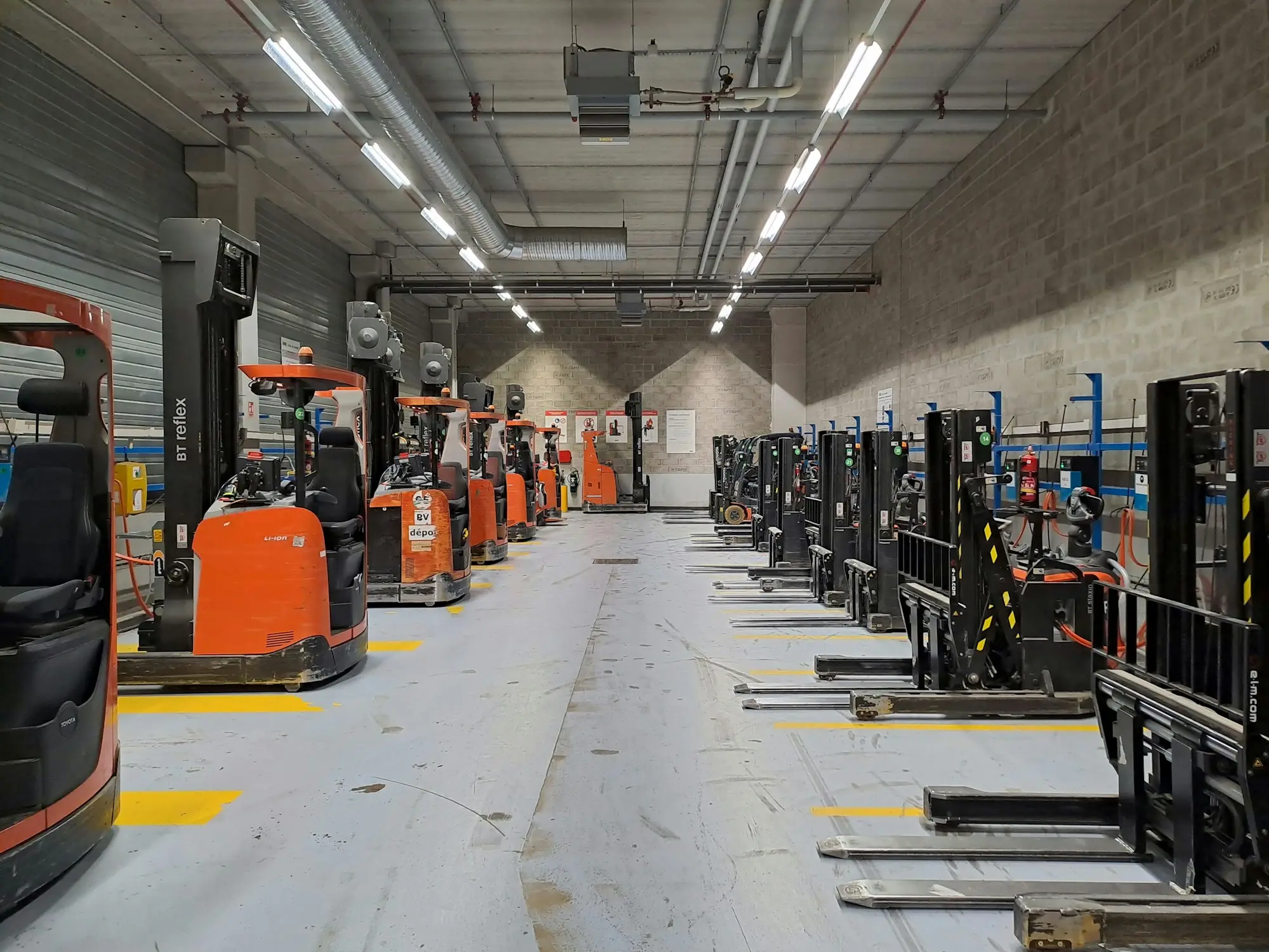 Warehouse aisle lined with forklifts ahead of the Christmas rush